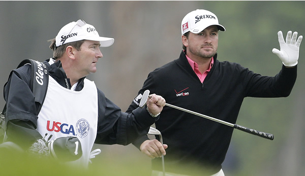 Graeme McDowell, of Northern Ireland, waves to...